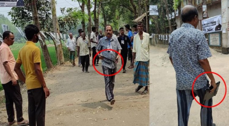 যুবলীগ কর্মী কেন্দ্র থেকে ইভিএম নিয়ে গেলেন